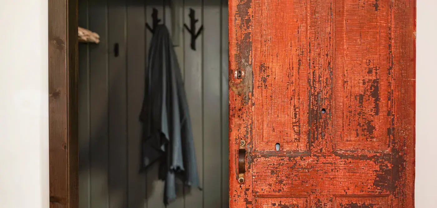 Reclaimed red door, repurposed as a barn door