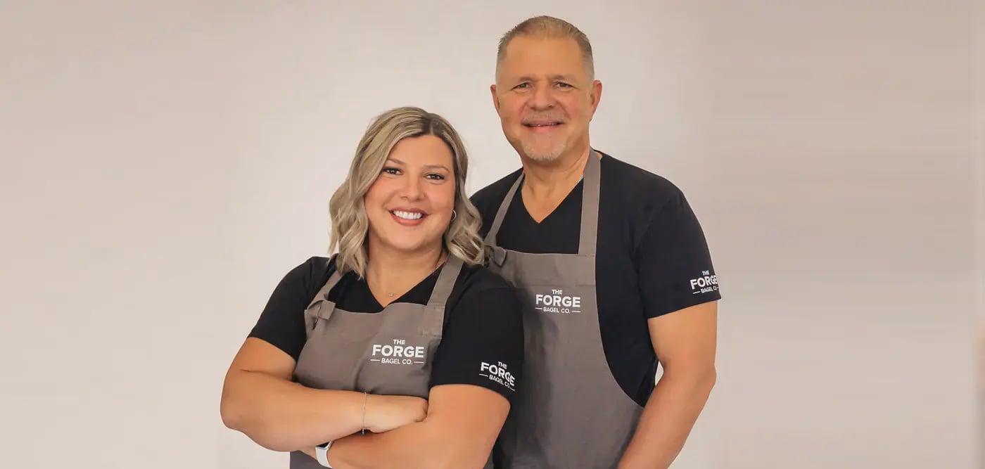our client glen and his daughter in their company aprons