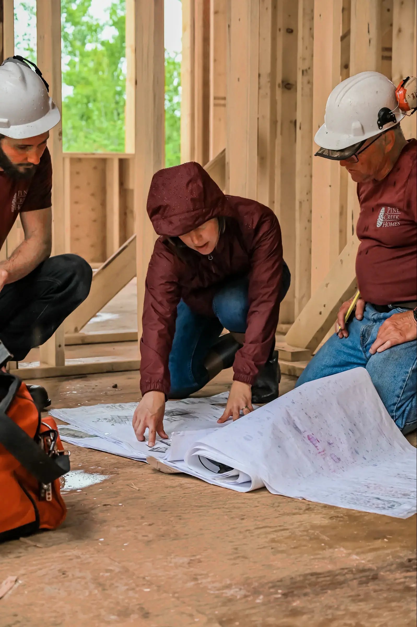 Pine Creek team reviewing drawings on site
