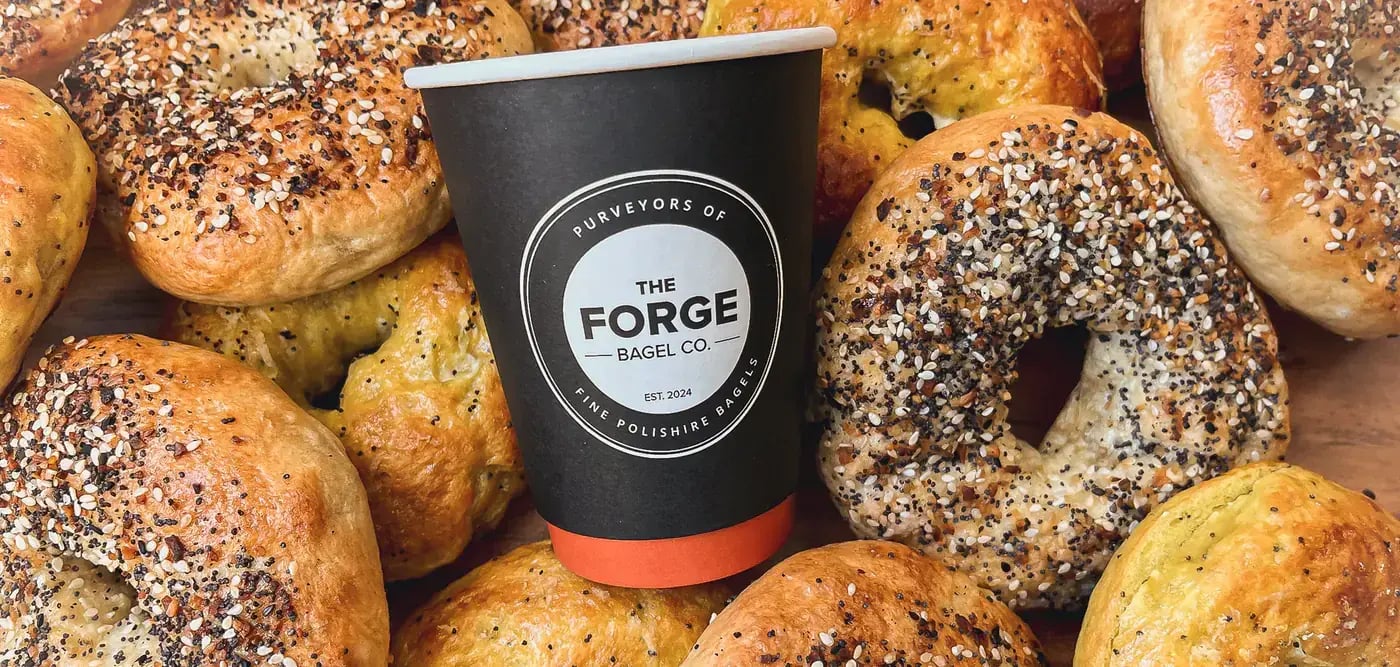 cup with the forge bagel co. logo